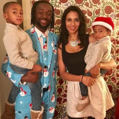 Kori Campfield in black poses with her kids and husband during Christmas.