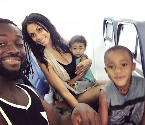 Kori Campfield poses with her children and husband Kofi Kingston,