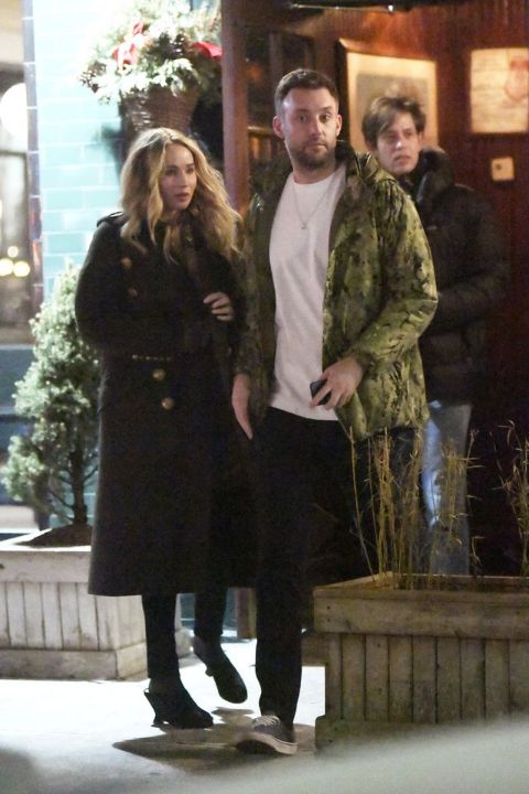 Cooke Maroney in a green jacket with wife Jennifer Lawrence.