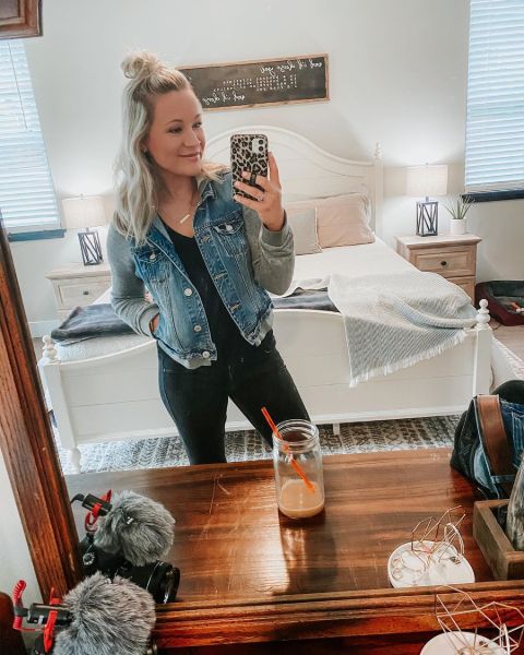 Kristin Kasper in a blue jacket poses for a mirror selfie.