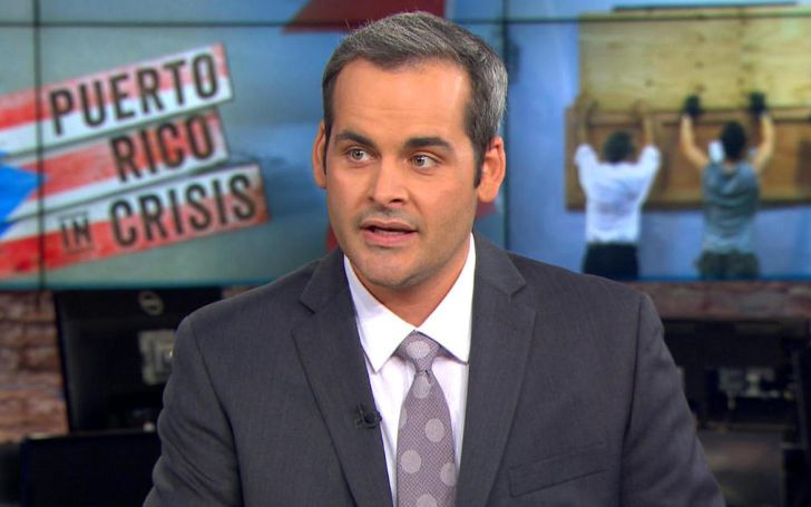 David Begnaud in a black suit live on television.