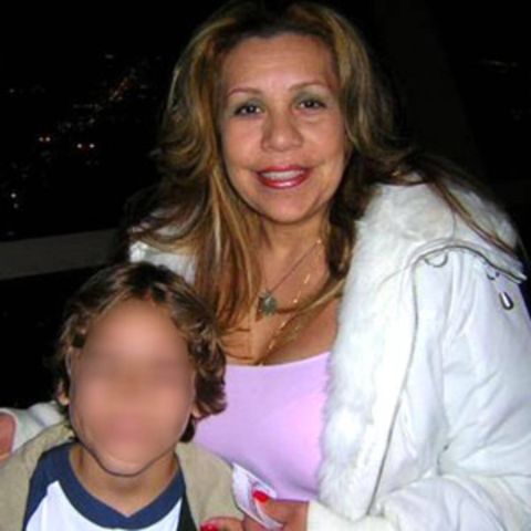Mildred Patricia Baena in white poses with her son.
