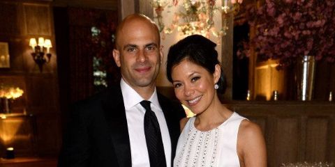 Alex Wagner and her husband Sam Kass poses for a picture.