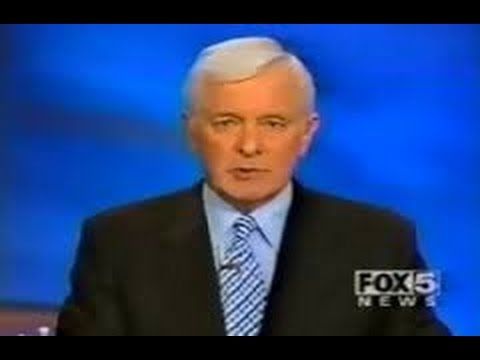 Jim Ryan in a black suit live on television.