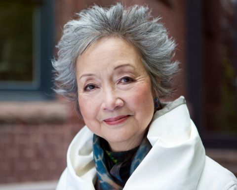 Adrienne Clarkson in a white jacket caught in the camera.