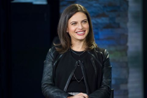 Bianna Golodryga in a black dress poses for a picture.