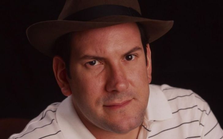 Matt Drudge in a white t-shirt poses for a picture.