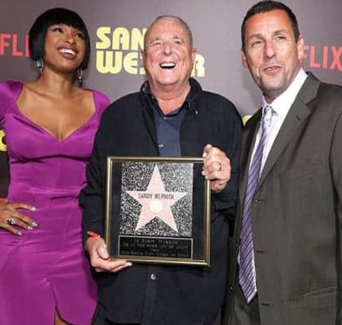 The actor, producer, consultant Sandy Wernick with his award alongside Adam Sandler.