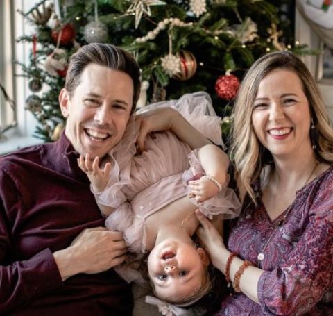Bobby Parrish celebrating Christmas with his wife and daughter.