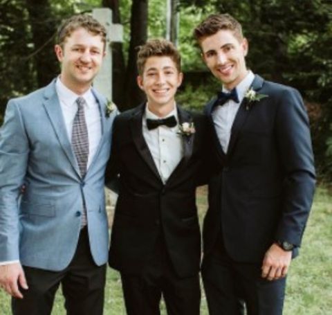 Jesse Callahan, 28, with his two brothers