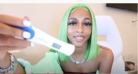 Diamond Nicole shows off pregnancy test kit.