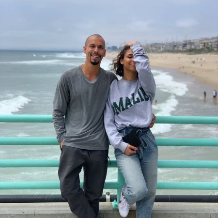 Bryton James and his co-star Brytni Sarphy are in beach.