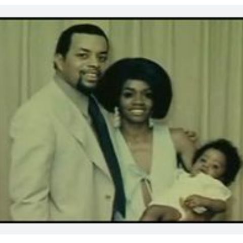 Melvin Earl Combs with his wife and child